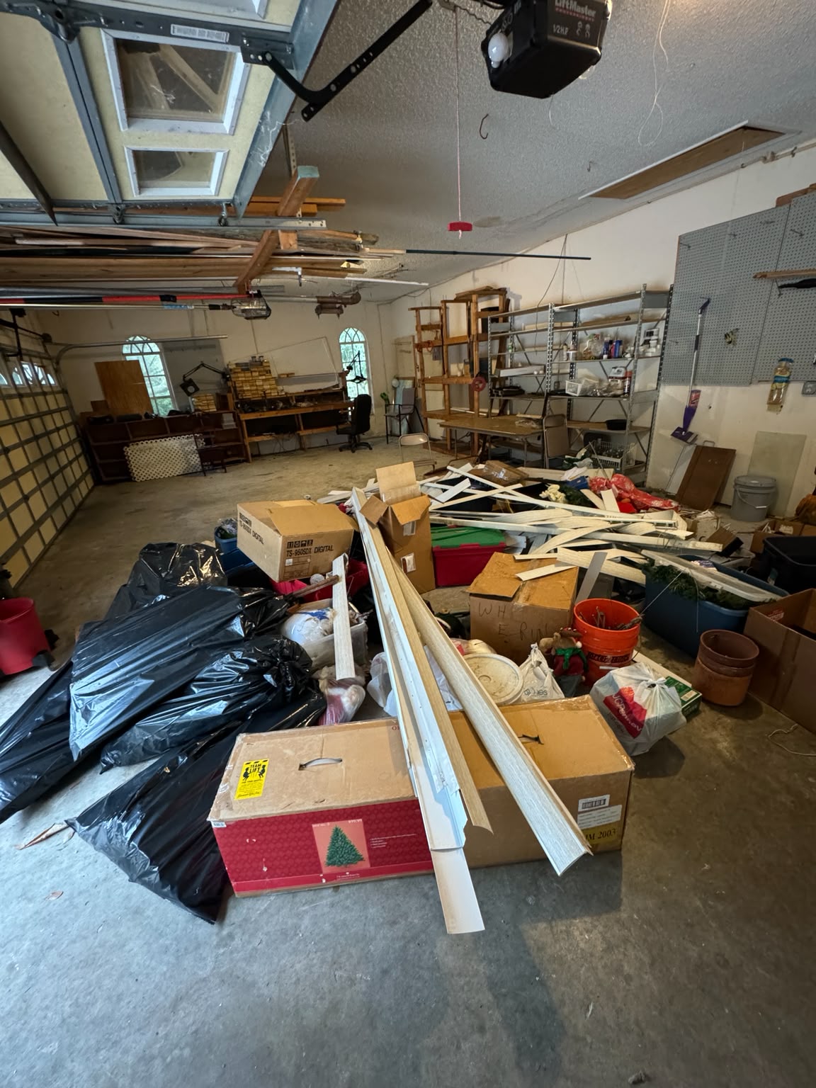 Garage packed with boxes, bags and construction trim